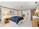 Inviting bedroom features a ceiling fan, and view into the living room at 3708 Plumosa Ter, Bradenton, FL 34210