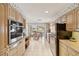 Large kitchen featuring light wood cabinets, stainless appliances, a double oven, and eat in breakfast area at 3708 Plumosa Ter, Bradenton, FL 34210