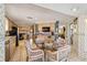 Eat-in kitchen offering a glass table, wicker chairs, and classic cabinetry for casual dining and water views at 3708 Plumosa Ter, Bradenton, FL 34210