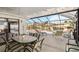 Outdoor lanai featuring dining and seating areas, with a view of the canal at 3708 Plumosa Ter, Bradenton, FL 34210