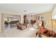 Cozy living room with plenty of natural light, plush seating, and an adjacent dining area at 3708 Plumosa Ter, Bradenton, FL 34210