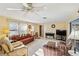 Inviting living room featuring an entertainment center, natural light, and views of the waterfront at 3708 Plumosa Ter, Bradenton, FL 34210