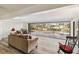 Bright living area with expansive views of the screened pool and waterfront through sliding glass doors at 3708 Plumosa Ter, Bradenton, FL 34210
