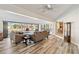 Open-concept living room with waterfront views, hardwood floors, and a cozy sitting area at 3708 Plumosa Ter, Bradenton, FL 34210