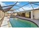 A screened in pool and deck area lead to a relaxing lanai and views of the canal at 3708 Plumosa Ter, Bradenton, FL 34210