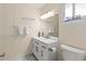Updated bathroom with a modern vanity, new fixtures, decorative mirror, and ample lighting at 3908 Panola Ln # 193, Sarasota, FL 34232