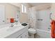 A well-lit bathroom featuring a tub and shower combination with a white vanity and sink at 3908 Panola Ln # 193, Sarasota, FL 34232