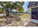 A view of the community with mature trees and landscaping; exterior features of the homes are visible at 3908 Panola Ln # 193, Sarasota, FL 34232