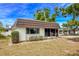 The property features a low-pitched roof, and lots of curb appeal via trimmed bushes at 3908 Panola Ln # 193, Sarasota, FL 34232
