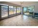 Well-lit, tiled lanai with screen windows and sliding glass door leading to other interior rooms at 3908 Panola Ln # 193, Sarasota, FL 34232
