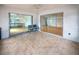 Spacious tiled lanai with sliding glass doors on two walls providing seamless indoor-outdoor living at 3908 Panola Ln # 193, Sarasota, FL 34232