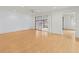 Bright living room featuring light wood floors, ceiling fan, and sliding doors to lanai at 3908 Panola Ln # 193, Sarasota, FL 34232