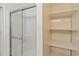 Bathroom featuring a glass-enclosed shower and open shelving at 3908 Panola Ln # 193, Sarasota, FL 34232