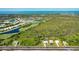 An aerial perspective of a residential area near the water, highlighting community amenities at 3910 Cape Haze Dr, Rotonda West, FL 33947