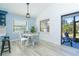 The dining area is adjacent to the kitchen and has a view of the backyard and lanai at 3910 Cape Haze Dr, Rotonda West, FL 33947