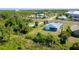 A cozy single-story home features a light blue exterior in a developing area at 3910 Cape Haze Dr, Rotonda West, FL 33947