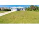 Charming single-story home with a well-maintained front yard and driveway at 3910 Cape Haze Dr, Rotonda West, FL 33947