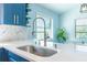 Bright kitchen featuring stainless steel faucet and modern herringbone backsplash with lots of natural light at 3910 Cape Haze Dr, Rotonda West, FL 33947