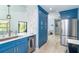 Modern kitchen design featuring stylish blue cabinetry, stainless steel appliances, and ample counter space at 3910 Cape Haze Dr, Rotonda West, FL 33947