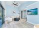Open-concept living room with vaulted ceilings and a sliding glass door to the outdoor patio at 3910 Cape Haze Dr, Rotonda West, FL 33947