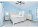 Spacious main bedroom with a large bed, ceiling fan, and bright, airy feel at 3910 Cape Haze Dr, Rotonda West, FL 33947