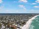 High-angle view of a coastal city, highlighting beachfront properties, waterfront homes, and coastal scenery at 402 71St St, Holmes Beach, FL 34217