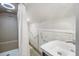 Compact bathroom with a unique shower and a fishnet nautical theme decoration at 402 71St St, Holmes Beach, FL 34217