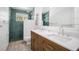 Stylish bathroom features a double sink vanity, tile shower, and modern fixtures at 402 71St St, Holmes Beach, FL 34217