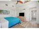 Bedroom with beachy decor features a bed, dresser, and ensuite bathroom at 402 71St St, Holmes Beach, FL 34217