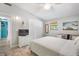 Well lit bedroom featuring white linens, and bright natural lighting, and ample storage at 402 71St St, Holmes Beach, FL 34217