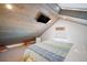 Cozy bedroom with a TV, sloped ceiling, and inviting decor at 402 71St St, Holmes Beach, FL 34217