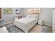 Serene bedroom featuring a full sized bed, desk, and bright natural lighting at 402 71St St, Holmes Beach, FL 34217