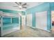 Bright and airy bedroom with bunk beds, closet and colorful accents at 402 71St St, Holmes Beach, FL 34217