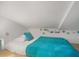 A simple bedroom with a bed and colorful string lights hanging on the wall at 402 71St St, Holmes Beach, FL 34217