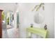 Inviting entryway with light table, decorative items, and view to outdoor area at 402 71St St, Holmes Beach, FL 34217