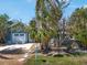 Lovely home featuring mature landscaping, a fenced yard, and a tranquil outdoor ambiance at 402 71St St, Holmes Beach, FL 34217