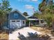 Charming home featuring a well-maintained exterior, driveway and inviting front porch at 402 71St St, Holmes Beach, FL 34217