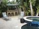 Poolside bar and lounge area, perfect for entertaining near the pool and hot tub at 402 71St St, Holmes Beach, FL 34217