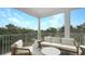 Inviting outdoor balcony with ample seating to enjoy beautiful views and fresh air at 4305 Marina View Way, Cortez, FL 34215