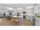 Modern kitchen with stainless steel appliances, center island and open to the living area at 4305 Marina View Way, Cortez, FL 34215