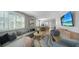 Open-concept living room seamlessly connected to the dining area with modern, stylish furnishings at 4305 Marina View Way, Cortez, FL 34215