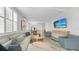Bright and airy living room with an open layout, leading to the dining area and kitchen at 4305 Marina View Way, Cortez, FL 34215