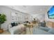 Spacious living room with dining area and modern decor, perfect for entertaining at 4305 Marina View Way, Cortez, FL 34215