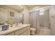 Bathroom with a vanity and shower/tub with neutral decor and a large mirror at 4420 Oak View Dr, Sarasota, FL 34232