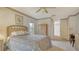 Inviting bedroom with natural light, neutral colors, and cozy patterned bedding at 4420 Oak View Dr, Sarasota, FL 34232