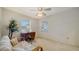 Bright bedroom with two windows, light-colored walls, and plush carpet at 4420 Oak View Dr, Sarasota, FL 34232
