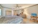 Spacious bedroom featuring a ceiling fan, dresser, and comfortable bedding at 4420 Oak View Dr, Sarasota, FL 34232
