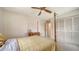 Cozy bedroom with a four-post bed, closet, and dresser for storage at 4420 Oak View Dr, Sarasota, FL 34232