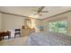Comfortable main bedroom with large windows, carpet, and a tranquil ambiance, with a view to the outdoors at 4420 Oak View Dr, Sarasota, FL 34232