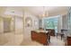 Cozy dining room area featuring neutral walls, chandelier lighting, and large windows at 4420 Oak View Dr, Sarasota, FL 34232